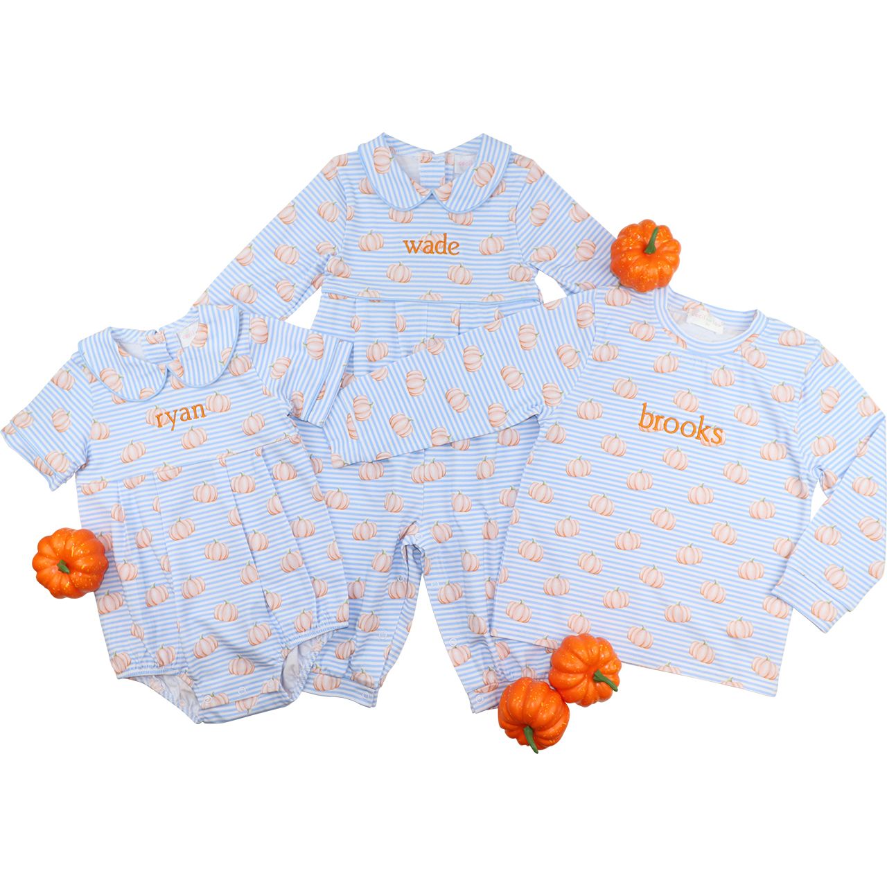 Baby clothing set with names 'ryan', 'wade', and 'brooks' on a white background with small pumpkins.