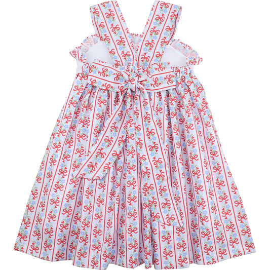 Children's dress with red and blue pattern on a white background