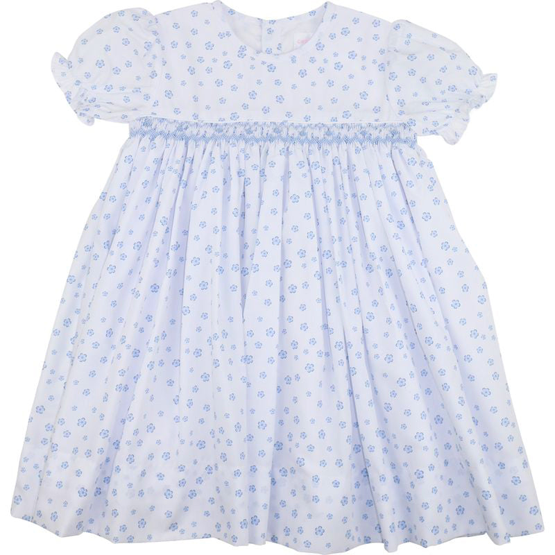 White dress with blue floral pattern on a white background