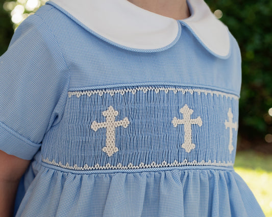 Blue bubble with white cross patterns on a blurred natural background