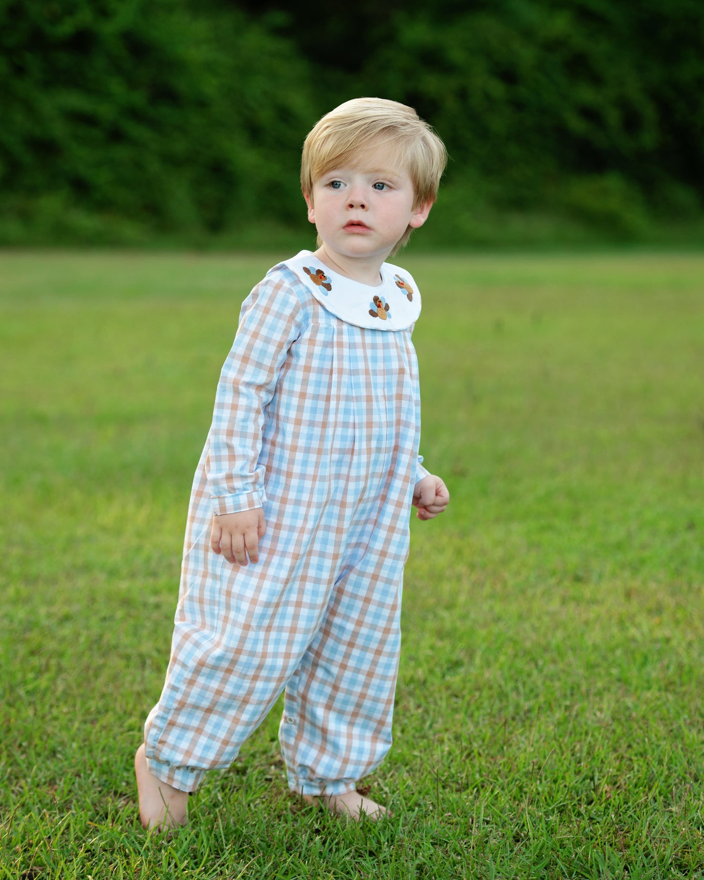 Boy Wearing Blue And Brown Check Embroidered Turkeys Long Romper