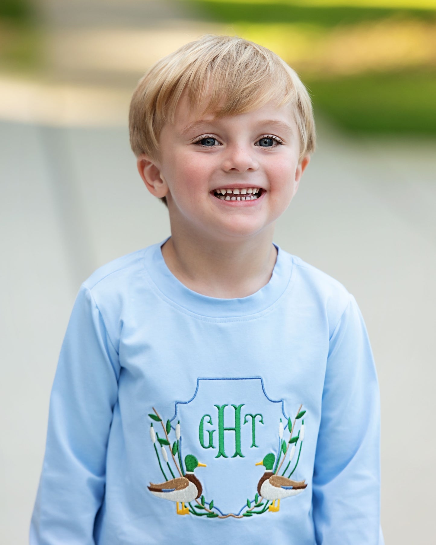Boy wearing Blue Knit Embroidered Mallards Shirt