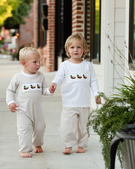 Boy wearing matching khaki stripe duck outfits