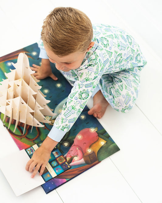 Child playing with a wooden puzzle on a colorful mat