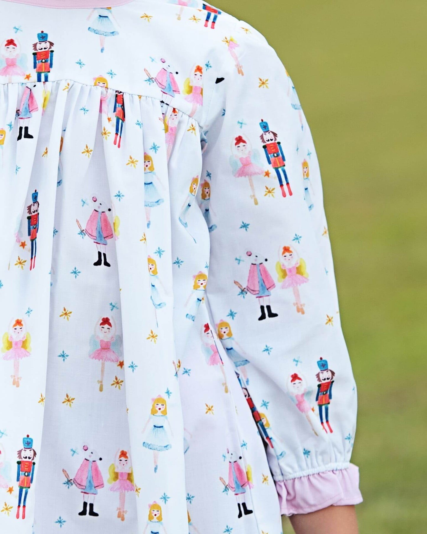 Children's nightgown with colorful nutcracker pattern on a light background