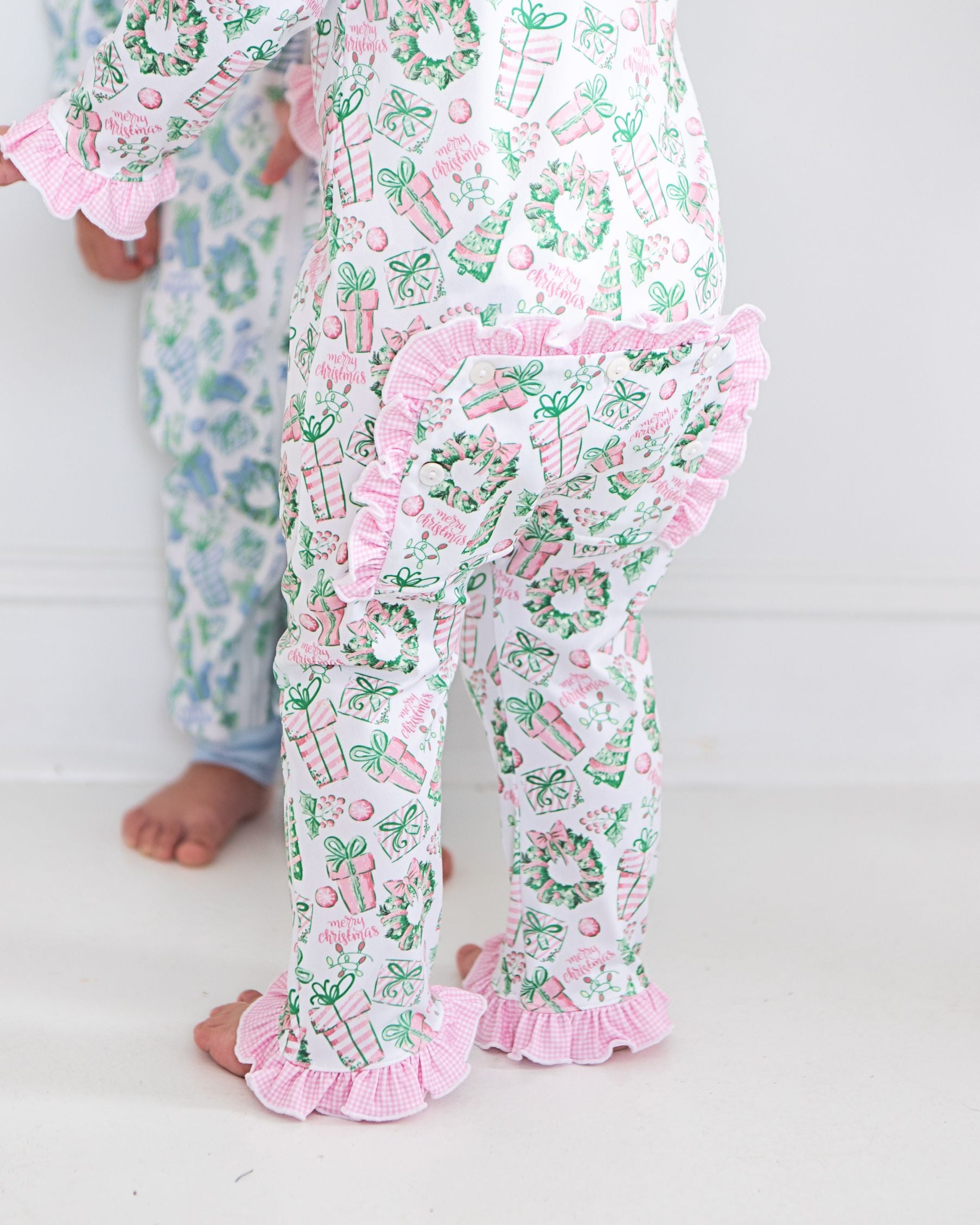Children's pajama set with festive pattern on a white background