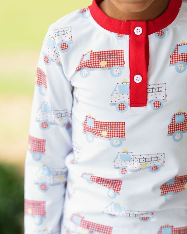 Close up of Boy wearing Firetruck Knit Pajamas