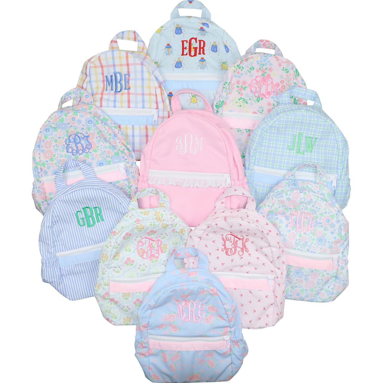 Collection of colorful backpacks with monogramming on a white background