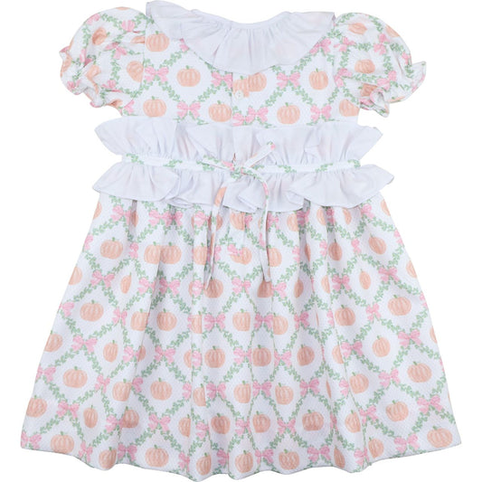 Dress with pumpkin and floral pattern on a white background