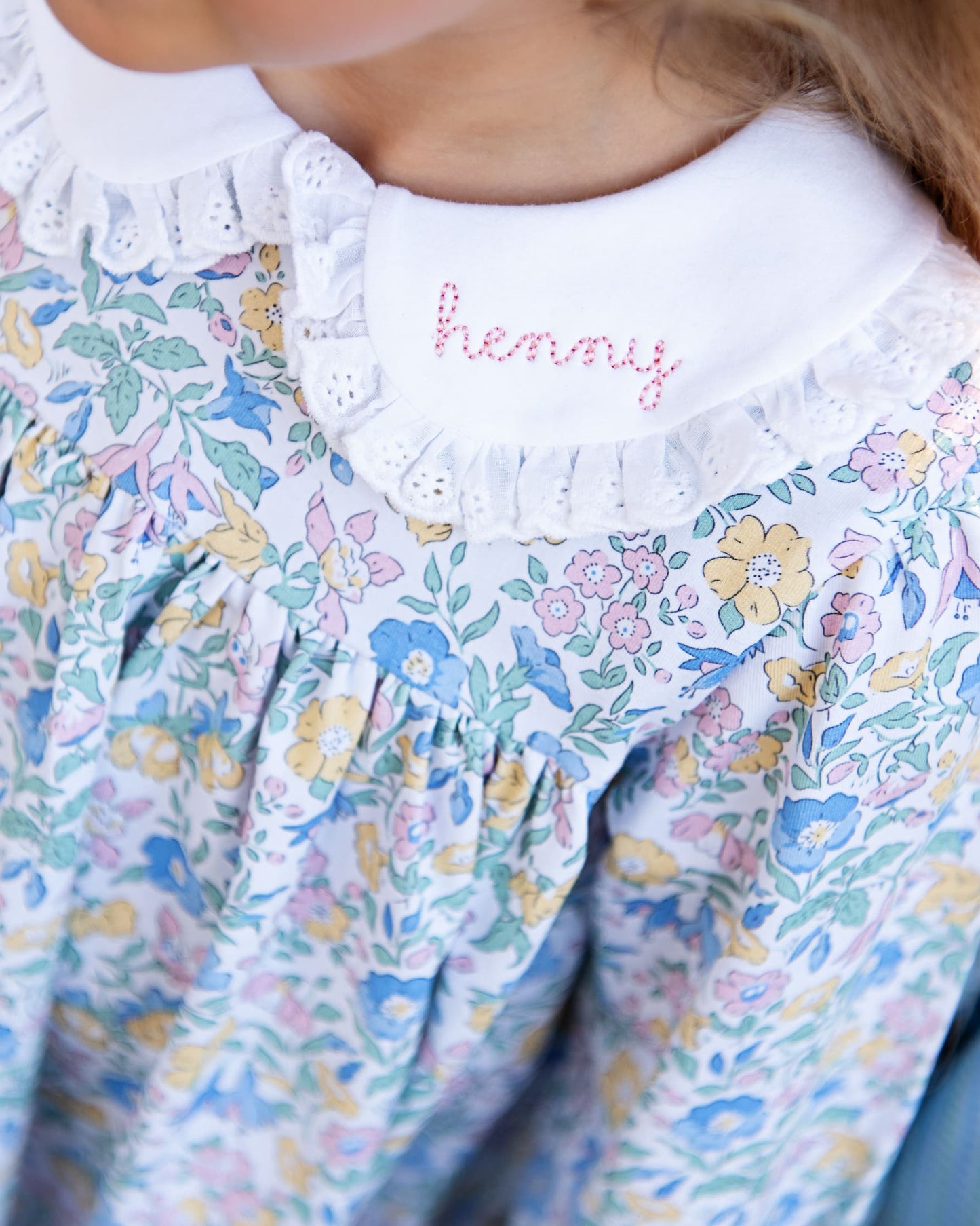 Floral dress with 'henny' embroidered on the collar