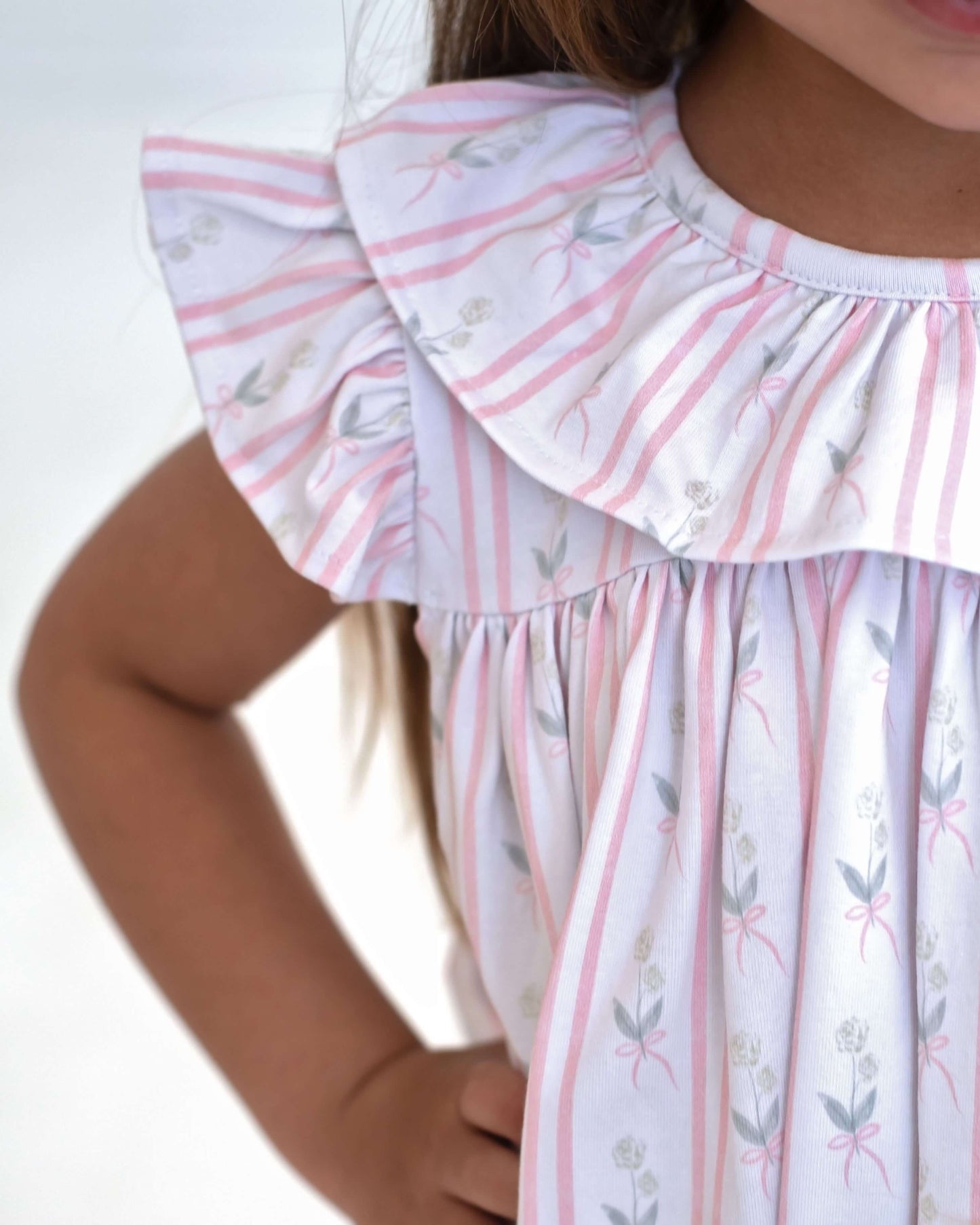 Floral stripped ruffle dress on a white bakground