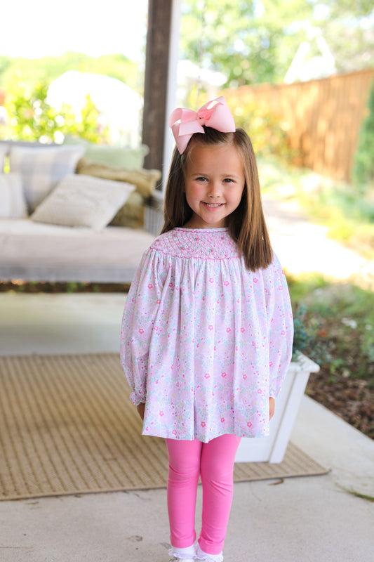 Girl wearing Pink And Green Floral Smocked Legging Set