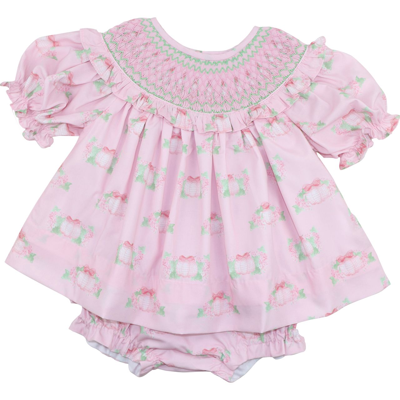 Pink diaper set with ruffles and pumpkin patterns on a white background
