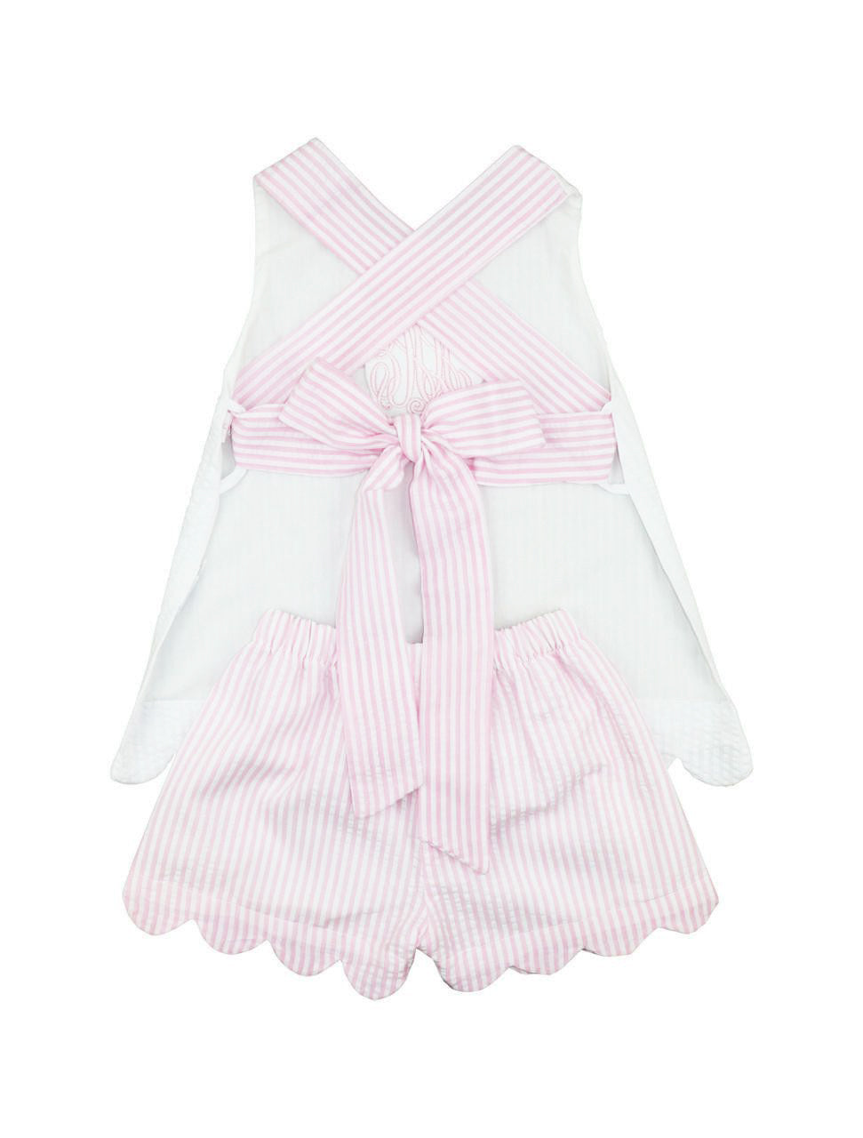 White short set with pink striped details on a white background