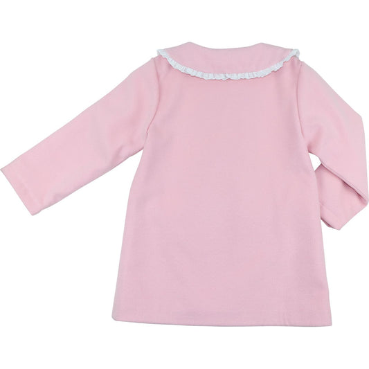 Pink baby dress with lace trim on a white background