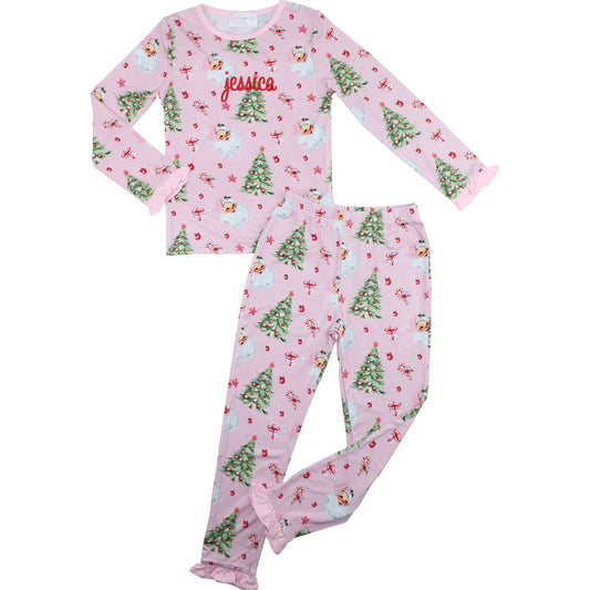Pink children's pajama set with Christmas tree pattern on a white background