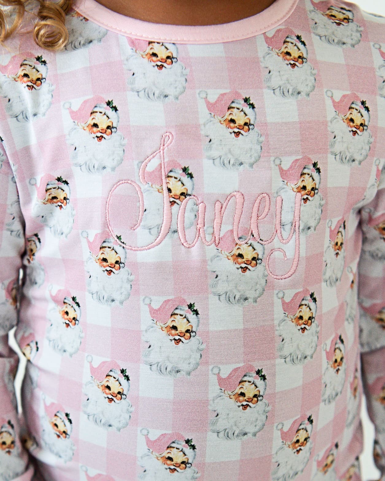 Pink pajama top with cartoon character pattern and 'Janey' text