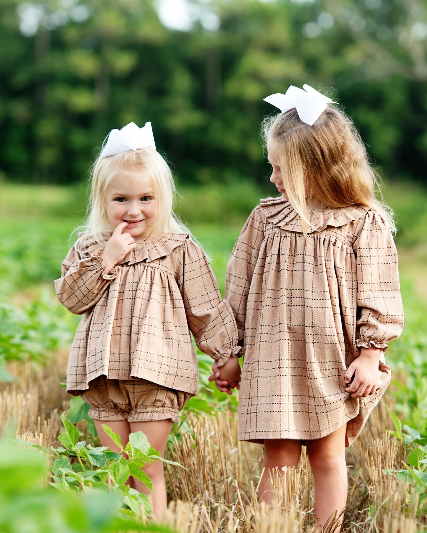 Two girls wearing matching outfits