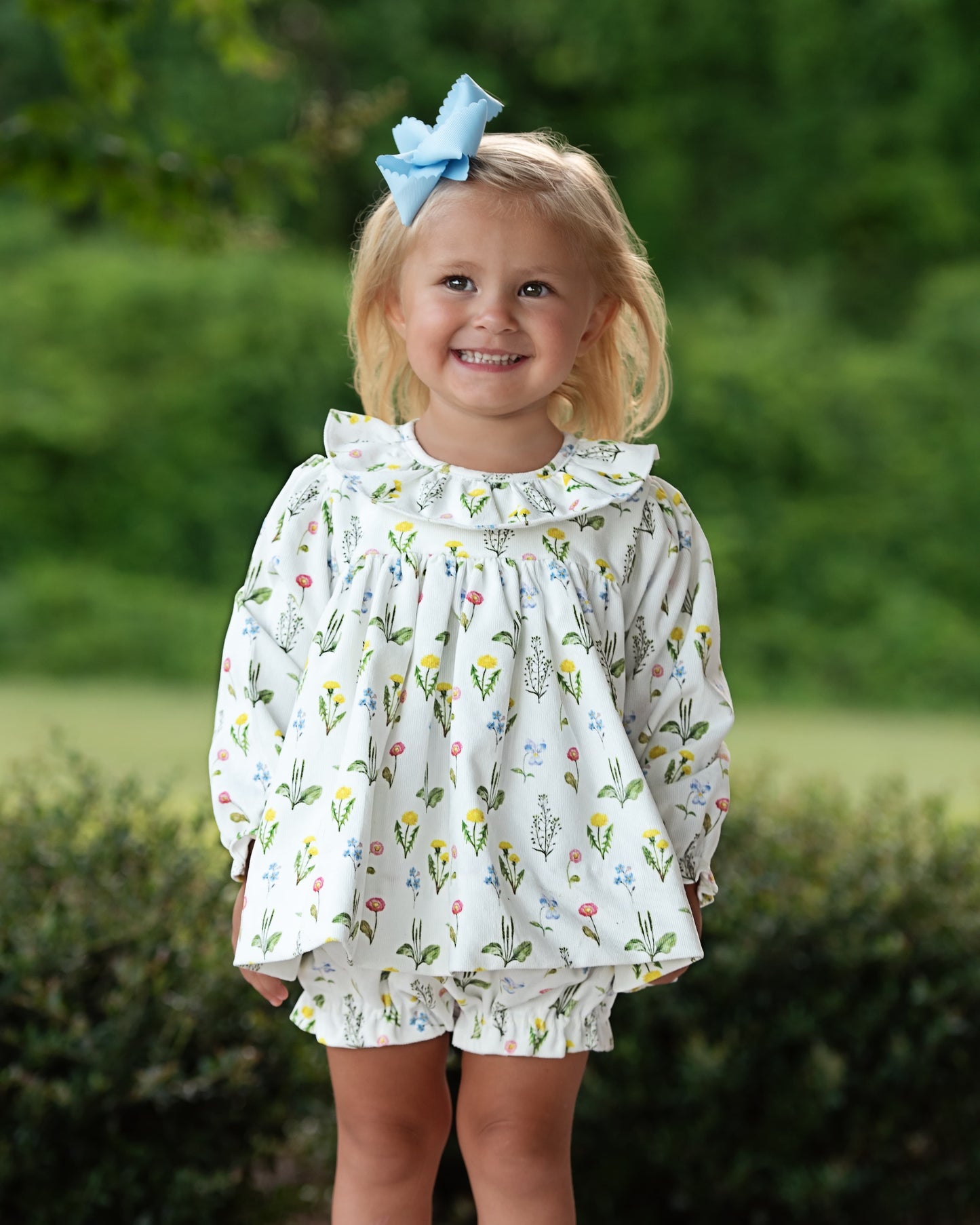 Young girl wearing Floral Blooms Corduroy Diaper Set