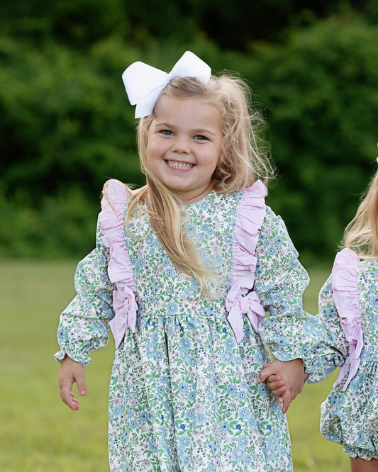 Young girl wearing Pink And Blue Floral Corduroy Bow Dress