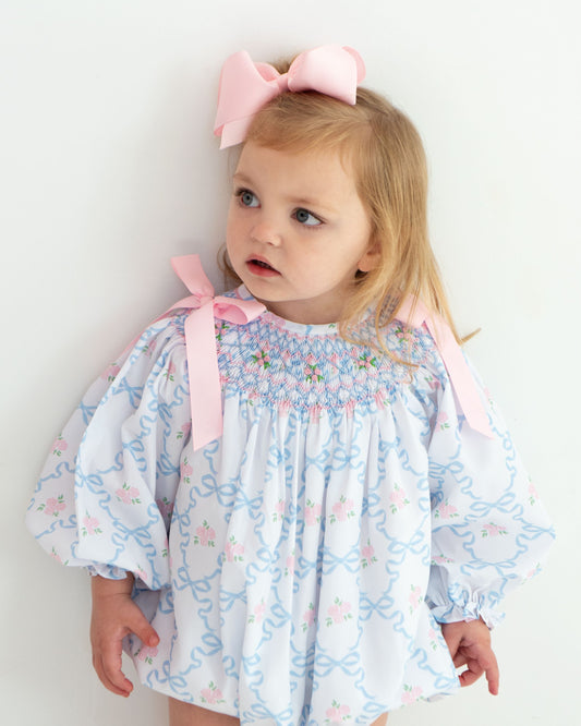 Young girl wearing Pink And Blue Ribbon And Rose Smocked Bubble