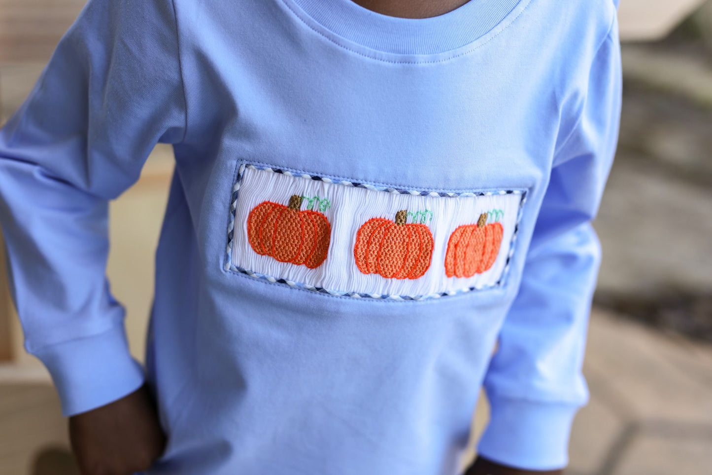 blue shirt with smocked pumpkins