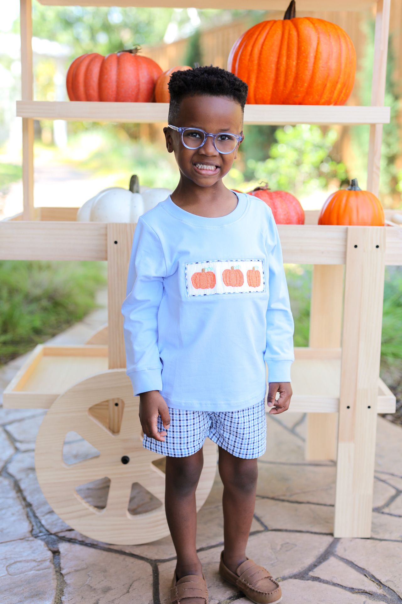 boy in blue and navy pumpkin short set