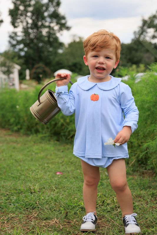 boy with blue single pumpkin diaper set holding bucket