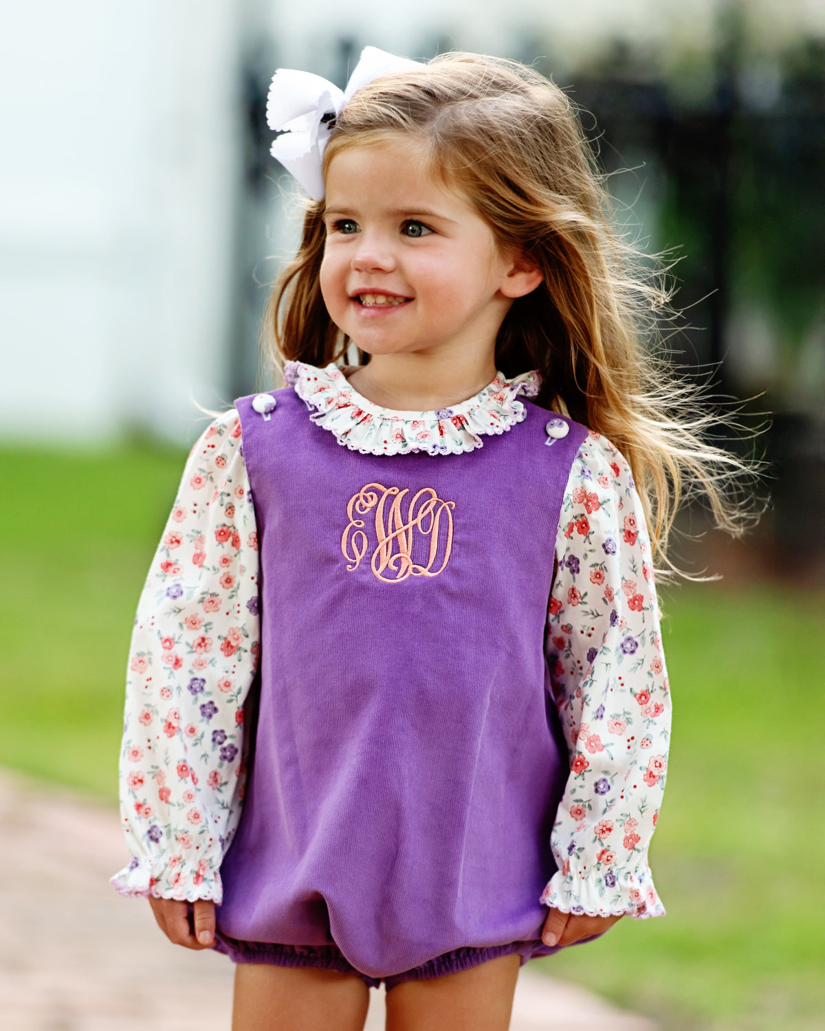 Girl wearing the Lavender Floral Corduroy Bubble Set outdoors
