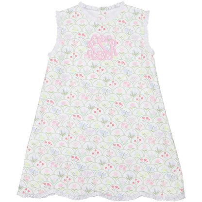 Children's dress with floral pattern and pink lettering on a white background