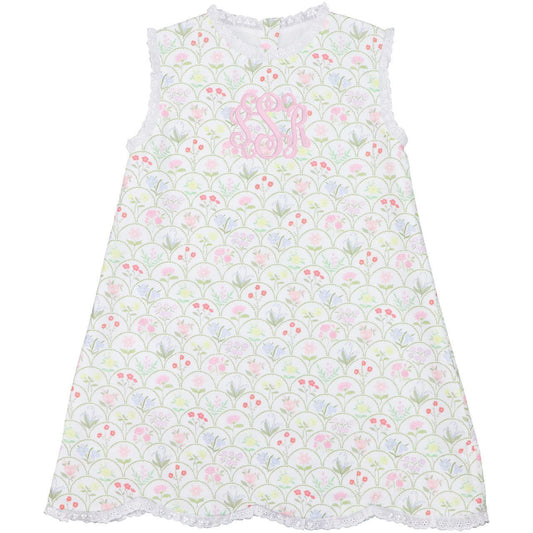 Children's dress with floral pattern and pink lettering on a white background