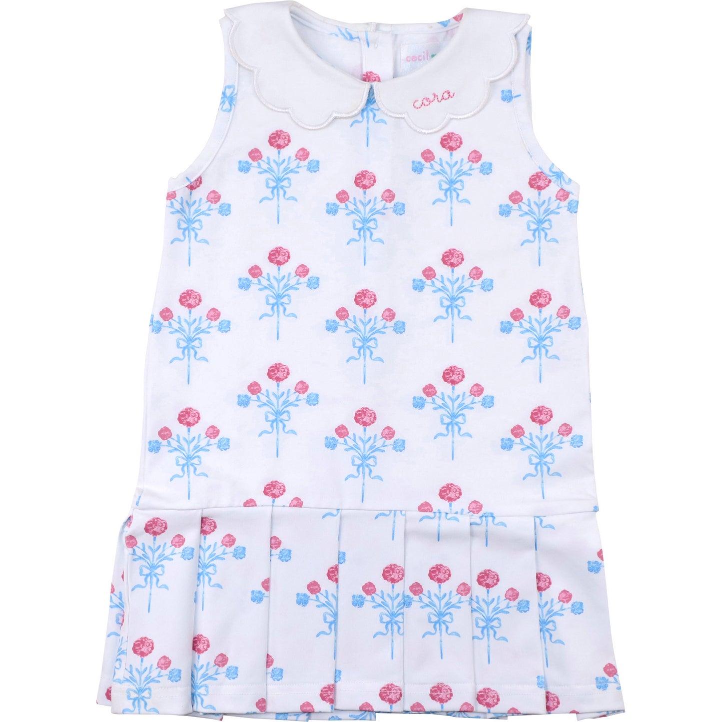 White dress with pink and blue floral pattern on a white background