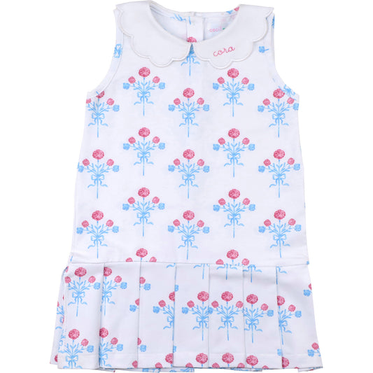 White dress with pink and blue floral pattern on a white background