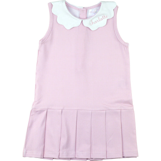 Pink checkered dress with white collar on a white background