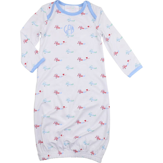 Baby boy bamboo gown with red and blue airplane print, light blue trim, elastic hem, and blue round monogram on chest, size NB.