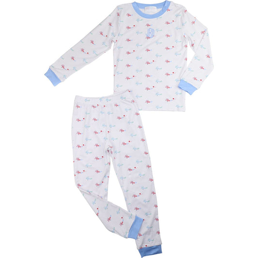 Boys bamboo pajamas with red and blue airplane print, light blue cuffs and collar, and blue round monogram on chest, two-piece set, size 3T.