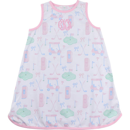 Baby dress with pink trim and colorful pattern on a white background