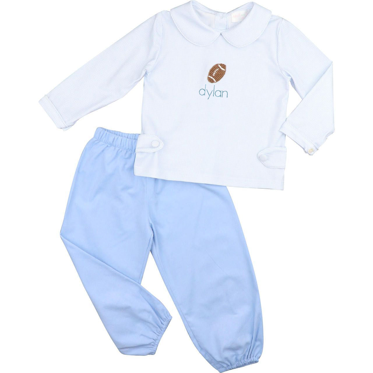 Baby outfit with white long-sleeve shirt and light blue pants on a white background