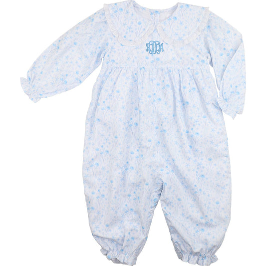 Baby romper with blue floral pattern and monogram on a white background
