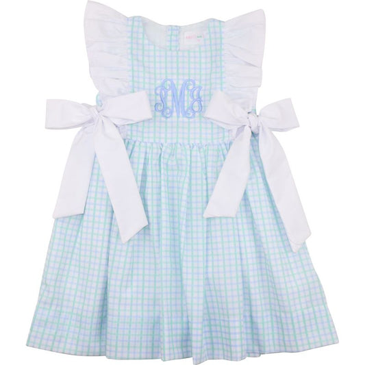 Checkered dress with white bows on a white background