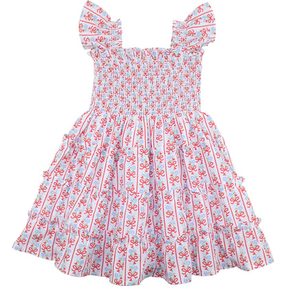 Children's dress with red and blue pattern on a white background