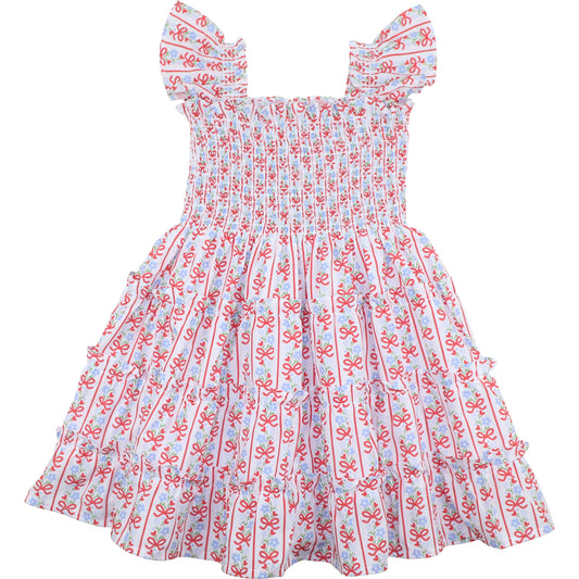 Children's dress with red and blue pattern on a white background