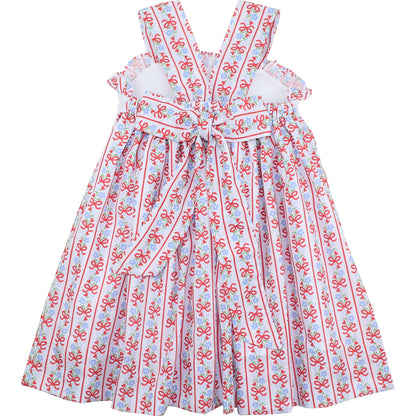 Children's dress with red and blue pattern on a white background