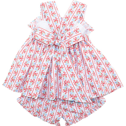Dress with red bow pattern on a white background