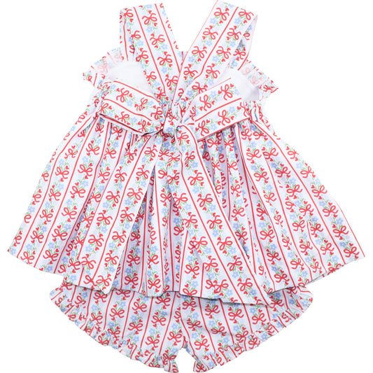Dress with red bow pattern on a white background