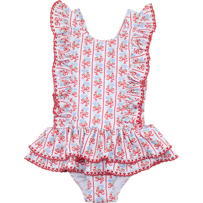 Children's swimsuit with red and blue floral pattern on a white background