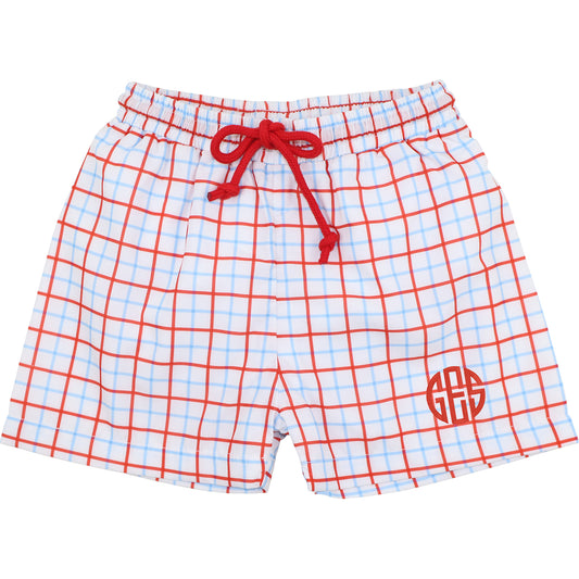 Plaid trunks with a red drawstring and monogram on a white background