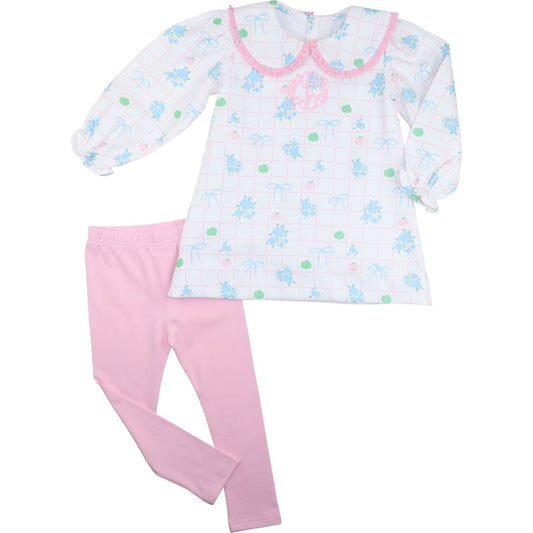 girl legging set with pumpkin-patterned top and pink pants on a white background