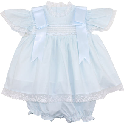 A blue heirloom lace diaper set for a baby girl, featuring a dress and bloomers with satin ribbons and lace details.