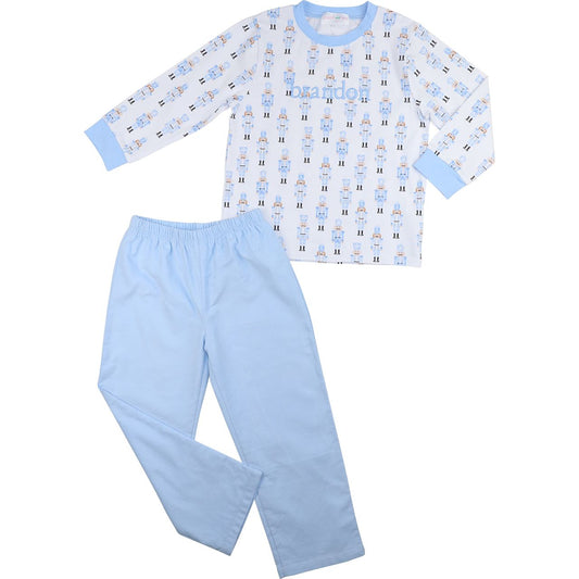 Children's pajama set with patterned top and solid pants on a white background